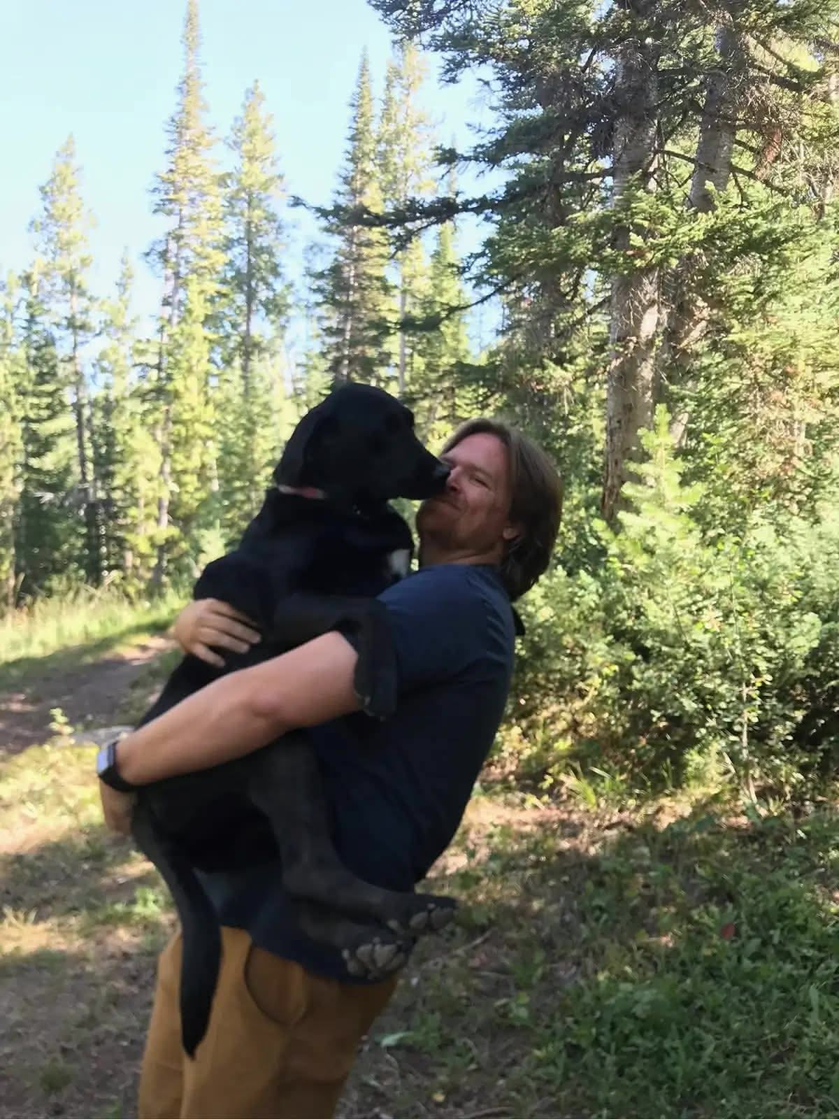 Ellie being held like a baby